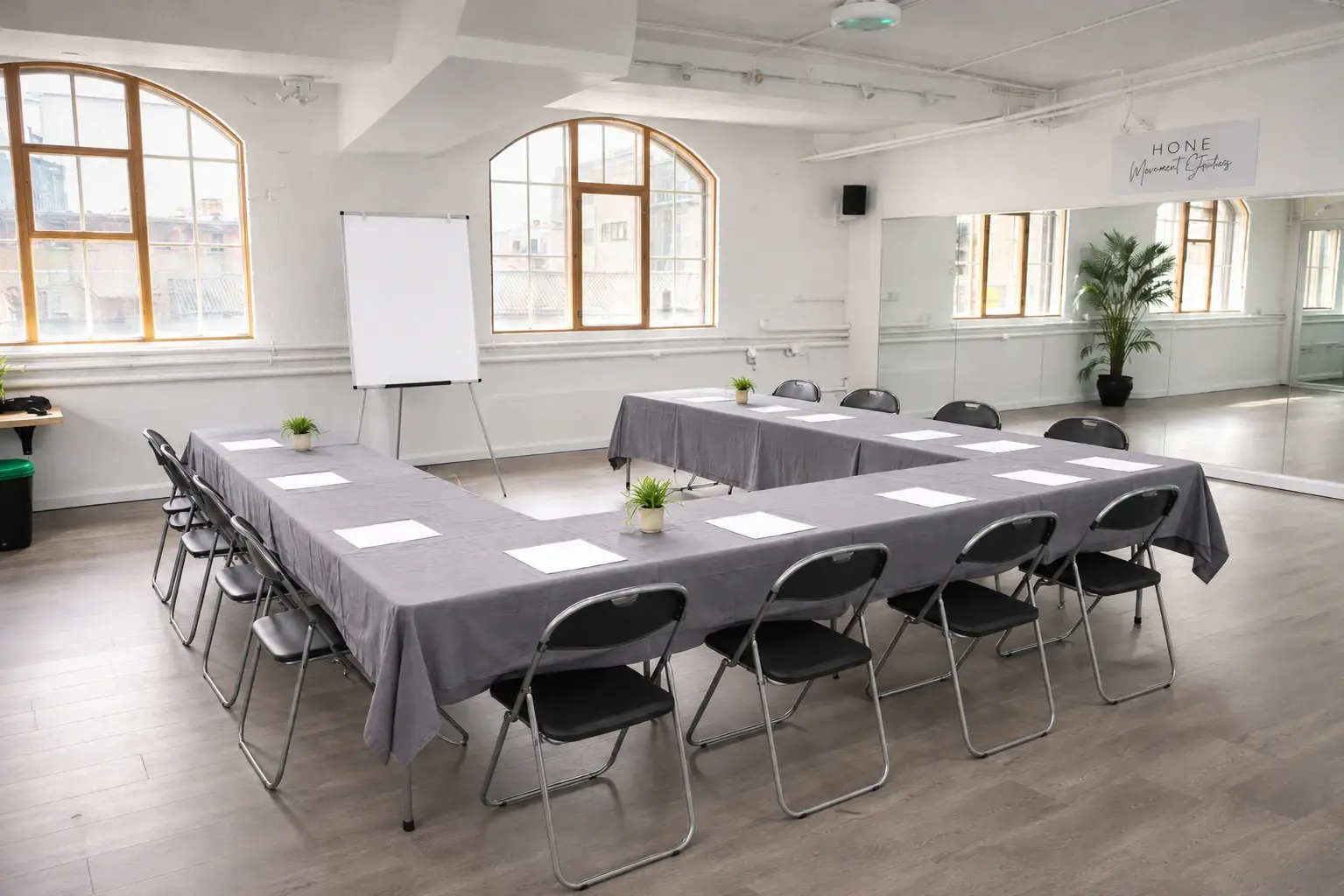 Meeting setup in Studio 49: table, chairs and whiteboard